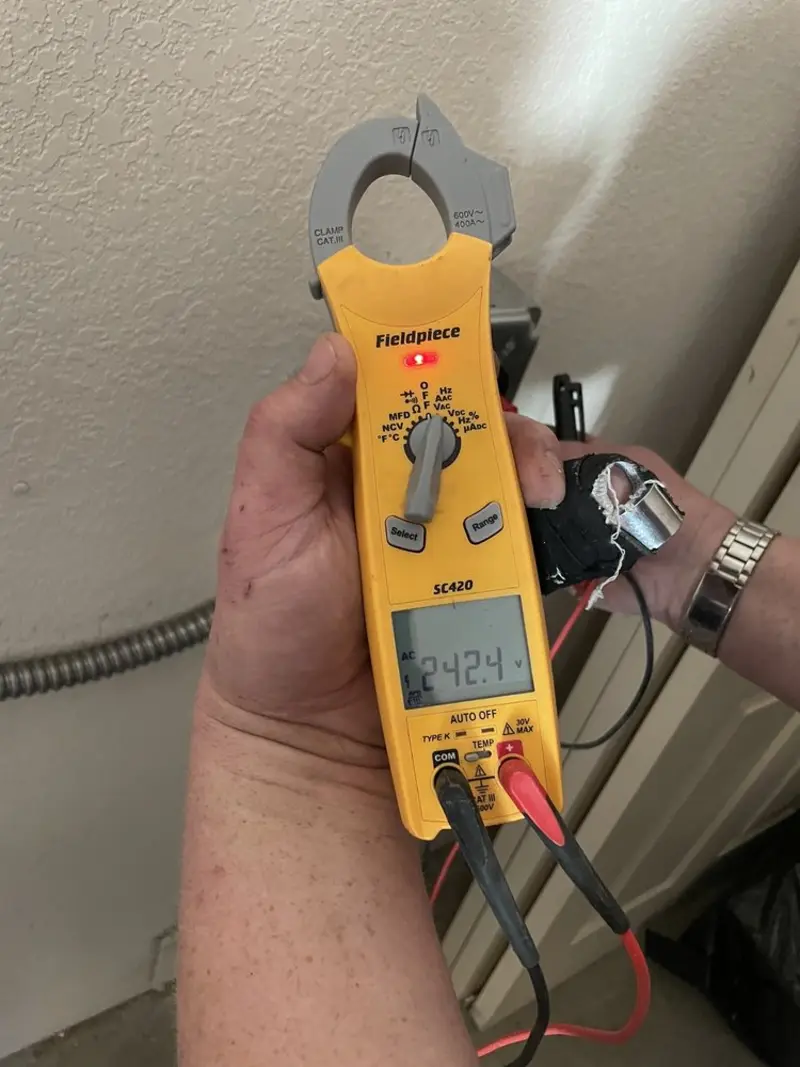 Voltage testing with clamp meter during Whole House Surge Protector in Bothell East